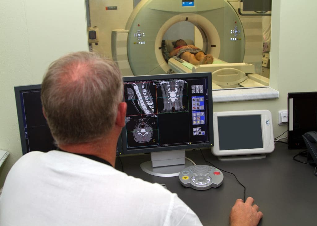 PET Scan and Biopsy: Cancer Diagnosis 1 doctor is doing ct scanning patients vertebrae LIV Hospital