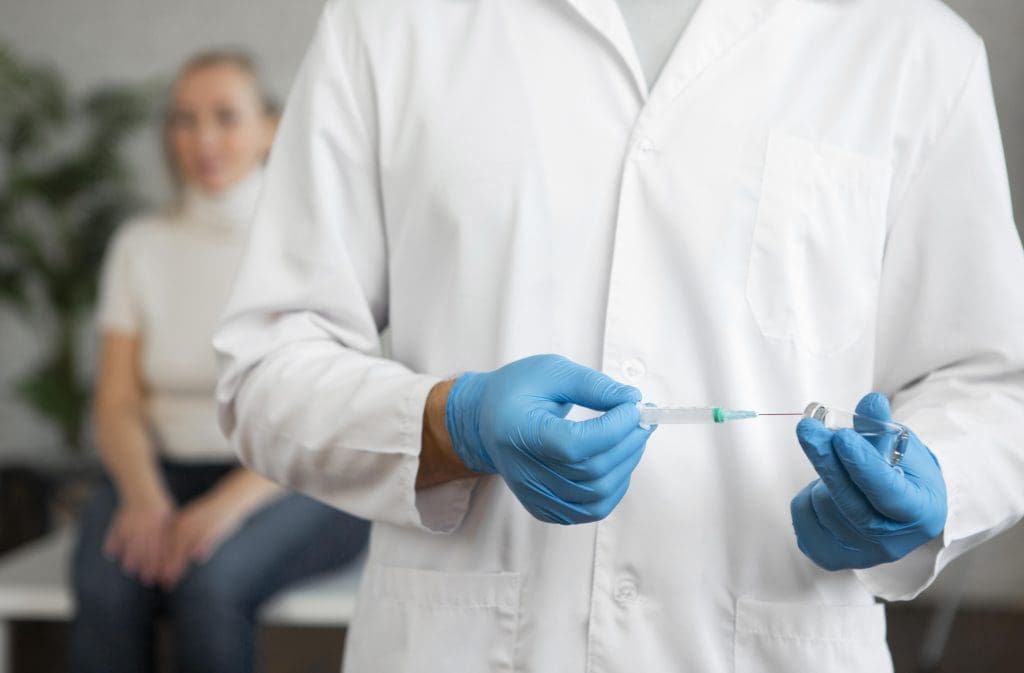 Benefits and Risks of Stem Cell Therapy Explained 1 close up hands holding syringe LIV Hospital