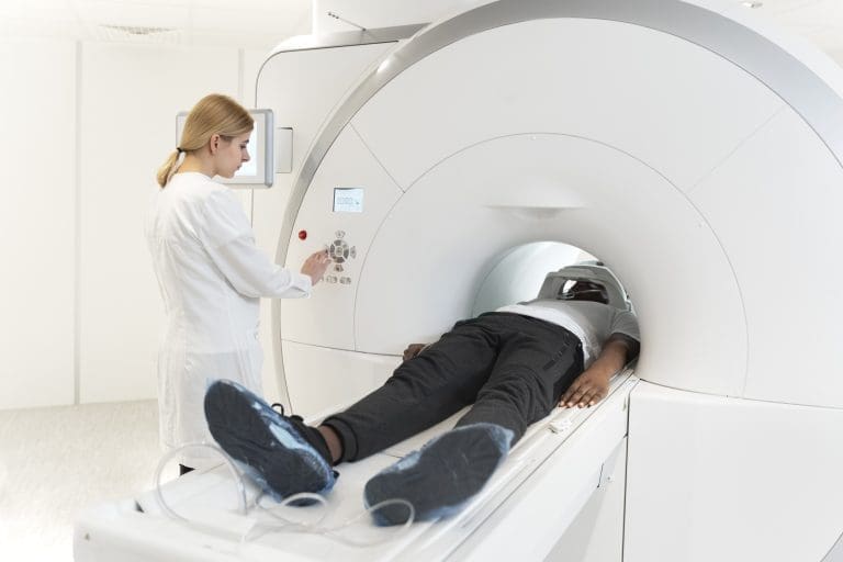 What causes lymph nodes to light up on a PET scan?