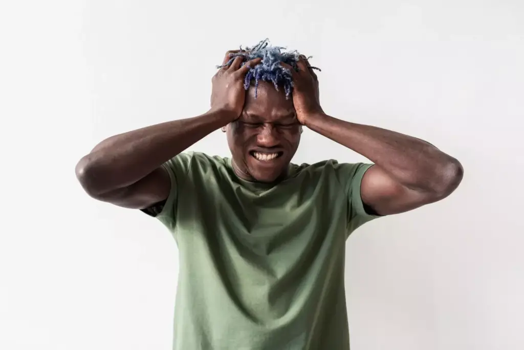 A person experiencing intense headaches, their expression conveying discomfort and distress. The brain in the foreground, surrounded by a hazy, ominous atmosphere, subtly hints at the underlying medical condition. Muted colors and dramatic lighting create a somber, introspective mood, emphasizing the gravity of the situation. The composition draws the viewer's attention to the pained expression, inviting empathy and understanding for the subject's struggle with persistent, debilitating headaches.