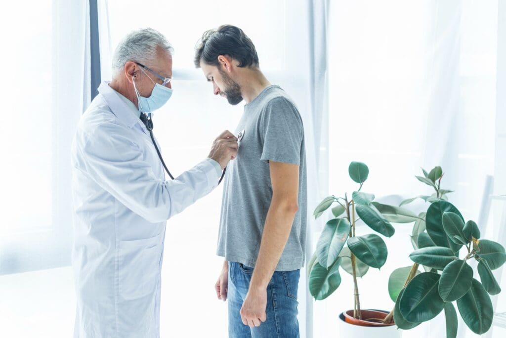 doctor examining patient