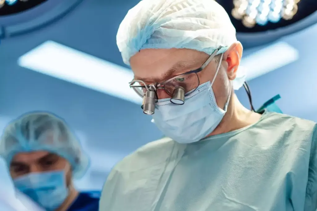 A detailed surgical scene of an advanced brain tumor removal procedure. In the bright, sterile operating room, a team of skilled neurosurgeons meticulously navigate a complex network of blood vessels and neural pathways using specialized microscopic instruments. Beams of focused light illuminate the intricate folds of the exposed brain, revealing the tumor's distinct, irregular shape. The surgeons work with unwavering precision, collaborating seamlessly to excise the malignant growth while preserving the surrounding healthy tissue. An atmosphere of intense focus and determination permeates the room, as the team battles to restore the patient's neurological function. Capture the gravity and technical mastery of this delicate, life-saving operation.