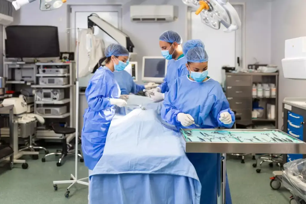 A bustling, well-lit surgical suite, with a team of four medical professionals intensely focused on their collaborative efforts. In the foreground, a surgeon in a crisp white coat carefully manipulates surgical instruments, their movements precise and practiced. Behind them, a scrub nurse assists, passing tools with efficient grace. In the middle ground, an anesthesiologist monitors vital signs on a sleek touchscreen console, brow furrowed in concentration. In the background, a circulating nurse organizes supplies, their actions complementing the team's seamless coordination. Soft, warm lighting illuminates the scene, creating an atmosphere of professionalism and quiet determination as the team works in harmony to ensure a successful outcome.