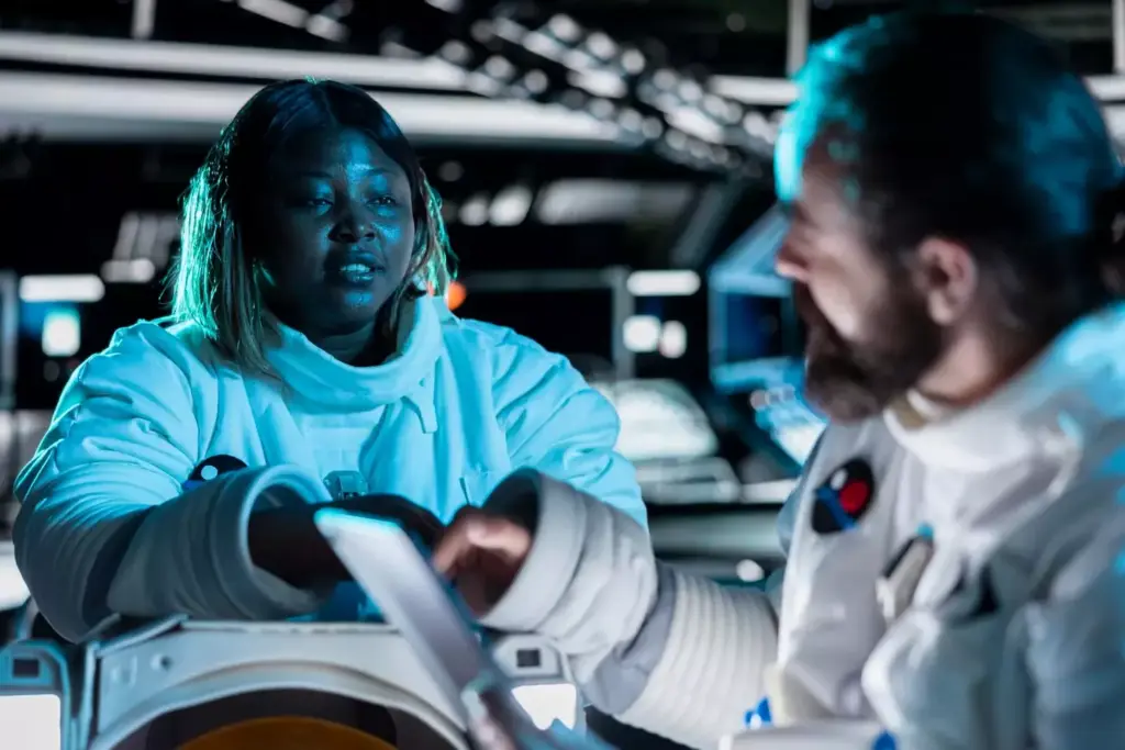 A state-of-the-art surgical robot stands in a bright, sterile operating theater. Its sleek, metallic limbs extend with precision, guided by a skilled surgeon at a nearby console. The robot's camera eye surveys the patient's body, relaying a detailed 3D image to the surgeon's display. Holographic overlays highlight critical anatomy, guiding the robot's delicate movements. Beams of laser light glide smoothly, sealing tissue and vessels. An atmosphere of cutting-edge technology and medical expertise permeates the scene, hinting at the remarkable advancements transforming modern healthcare.