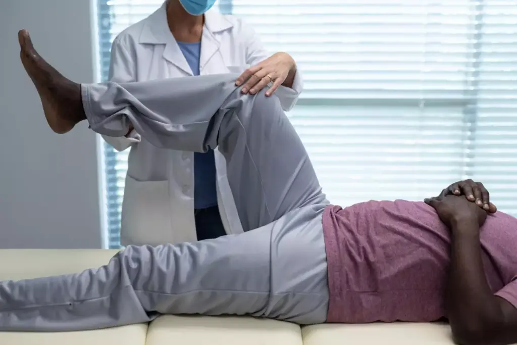 A detailed, photorealistic illustration of an ACL (Anterior Cruciate Ligament) reconstruction physical therapy protocol. The foreground depicts a patient's leg, with the knee joint prominently featured, undergoing various exercises and stretches performed by a physical therapist in a clinical setting. The middle ground showcases the physical therapist guiding the patient through the rehabilitation process, utilizing equipment such as resistance bands, balance boards, and exercise balls. The background features a clean, well-lit physiotherapy clinic, with neutral-toned walls and modern medical equipment, creating a calming and professional atmosphere. The lighting is soft and natural, highlighting the intricate details of the leg and the therapist's movements. The overall scene conveys a sense of understanding, expertise, and the patient's journey towards recovery.