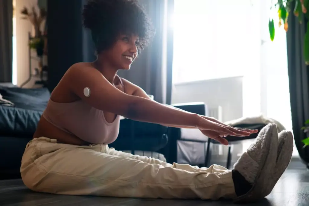 A patient undergoing ACL reconstruction recovery, sitting on a bench in a physical therapy clinic. Sunlight streams through large windows, casting a warm, hopeful glow. The patient examines their knee, wrapped in a supportive brace, as a physical therapist guides them through gentle exercises. The mood is one of determination and optimism, reflecting the gradual progress expected during the rehabilitation process. The image captures the patient's journey, showcasing the care and expertise of the medical professionals supporting their recovery. A patient undergoing ACL reconstruction recovery, sitting on a bench in a physical therapy clinic. Sunlight streams through large windows, casting a warm, hopeful glow. The patient examines their knee, wrapped in a supportive brace, as a physical therapist guides them through gentle exercises. The mood is one of determination and optimism, reflecting the gradual progress expected during the rehabilitation process. The image captures the patient's journey, showcasing the care and expertise of the medical professionals supporting their recovery.