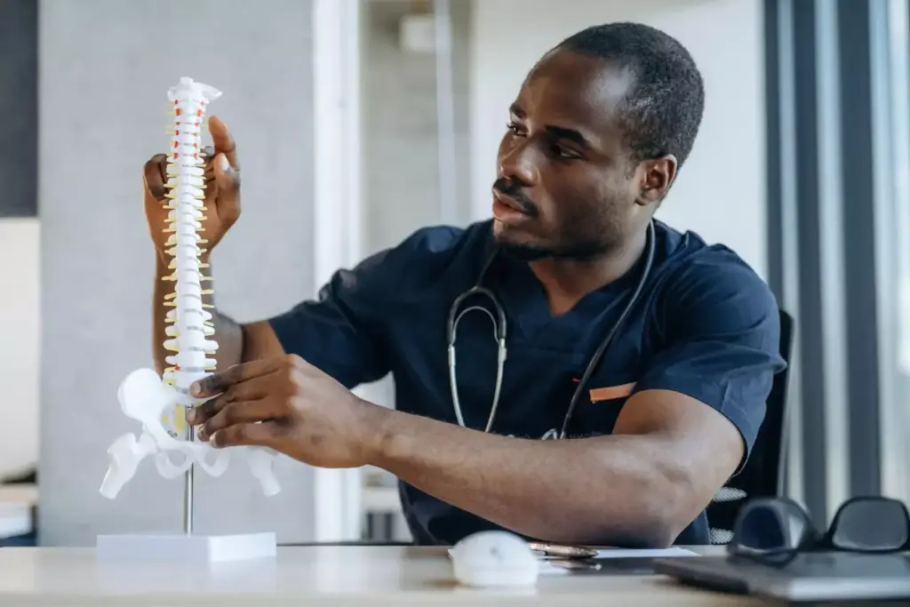 A detailed cross-section of the spinal autofusion process. In the foreground, the vertebrae are gradually fusing together through a network of bony growths and connective tissue. The middle ground shows the spinal column with its natural curvatures, captured in a cutaway view to reveal the internal structures. In the background, a hazy medical diagram sets the context, showcasing the complex anatomy of the spine. Soft, indirect lighting accentuates the textures and highlights the delicate biological mechanisms at work. The overall mood is one of clinical precision and scientific introspection, inviting the viewer to contemplate the wonders of the human body's self-healing capacities. A detailed cross-section of the spinal autofusion process. In the foreground, the vertebrae are gradually fusing together through a network of bony growths and connective tissue. The middle ground shows the spinal column with its natural curvatures, captured in a cutaway view to reveal the internal structures. In the background, a hazy medical diagram sets the context, showcasing the complex anatomy of the spine. Soft, indirect lighting accentuates the textures and highlights the delicate biological mechanisms at work. The overall mood is one of clinical precision and scientific introspection, inviting the viewer to contemplate the wonders of the human body's self-healing capacities.