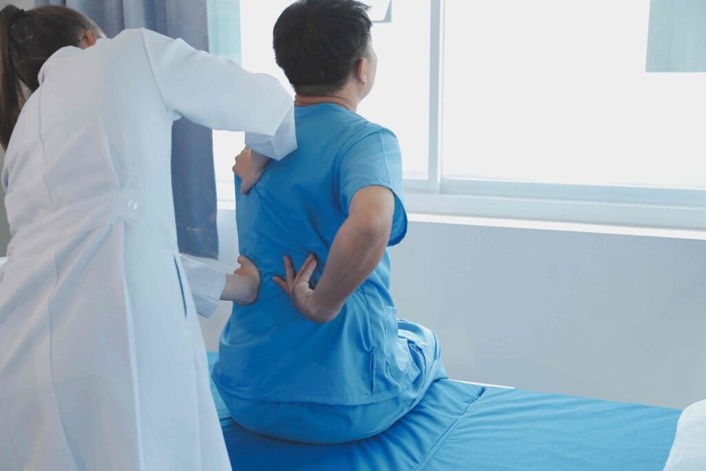 A surgical procedure being performed on a patient's spine, showcasing the degenerative disc disease A surgical procedure being performed on a patient's spine, showcasing the degenerative disc disease
