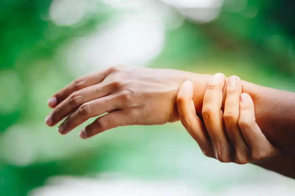 A close-up view of a well-healed carpal tunnel release surgery scar on the palm of a hand. The scar is approximately 2 inches long, with clean, slightly raised edges and a pinkish-red color. The skin around the scar appears smooth and supple, indicating proper healing. The lighting is soft and diffused, casting gentle shadows that accentuate the texture and contours of the scar. The angle is slightly tilted to provide a detailed, three-dimensional perspective of the scar's appearance. The overall mood is clinical yet informative, focusing on the key visual details that would be useful for understanding the typical appearance of a post-surgical carpal tunnel scar. A close-up view of a well-healed carpal tunnel release surgery scar on the palm of a hand. The scar is approximately 2 inches long, with clean, slightly raised edges and a pinkish-red color. The skin around the scar appears smooth and supple, indicating proper healing. The lighting is soft and diffused, casting gentle shadows that accentuate the texture and contours of the scar. The angle is slightly tilted to provide a detailed, three-dimensional perspective of the scar's appearance. The overall mood is clinical yet informative, focusing on the key visual details that would be useful for understanding the typical appearance of a post-surgical carpal tunnel scar.