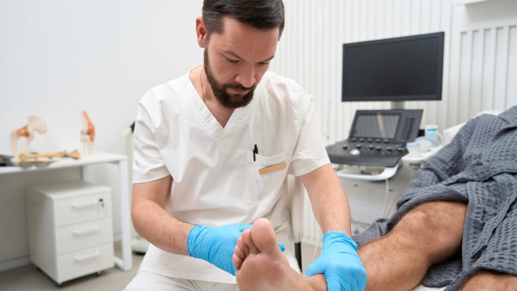 doctor examining foot