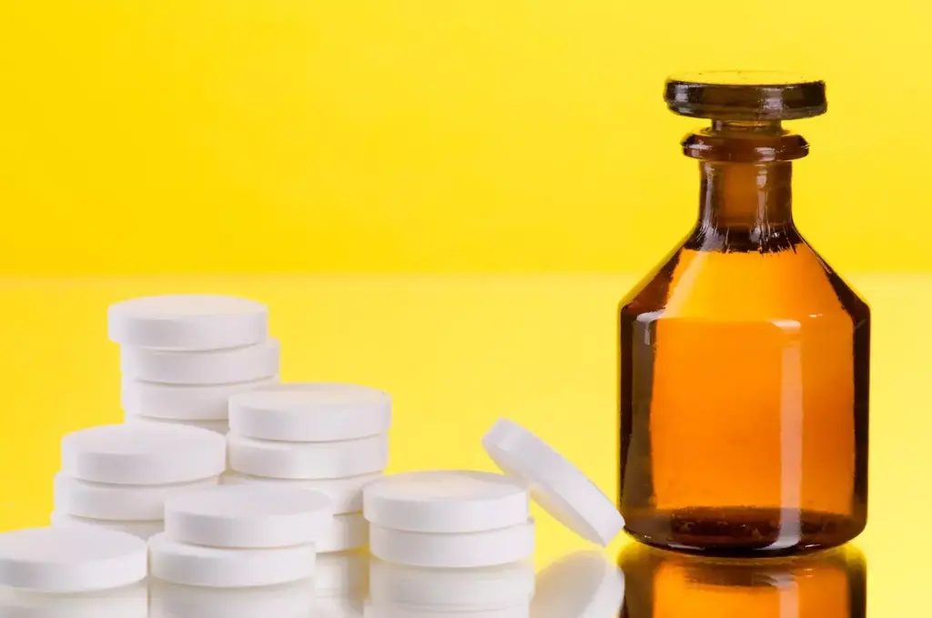 A well-lit, close-up photograph of various over-the-counter arthritis medication bottles and tubes, arranged in the foreground on a clean, neutral-colored surface. The medications should be clearly visible, showcasing their packaging, labels, and forms (e.g., creams, gels, pills). The background should be blurred, creating a soft, inviting atmosphere that emphasizes the products. Capture the medications from a slightly elevated angle, using natural lighting and a shallow depth of field to highlight the details and textures of the items. Convey a sense of relief, ease, and accessibility associated with over-the-counter arthritis treatments.