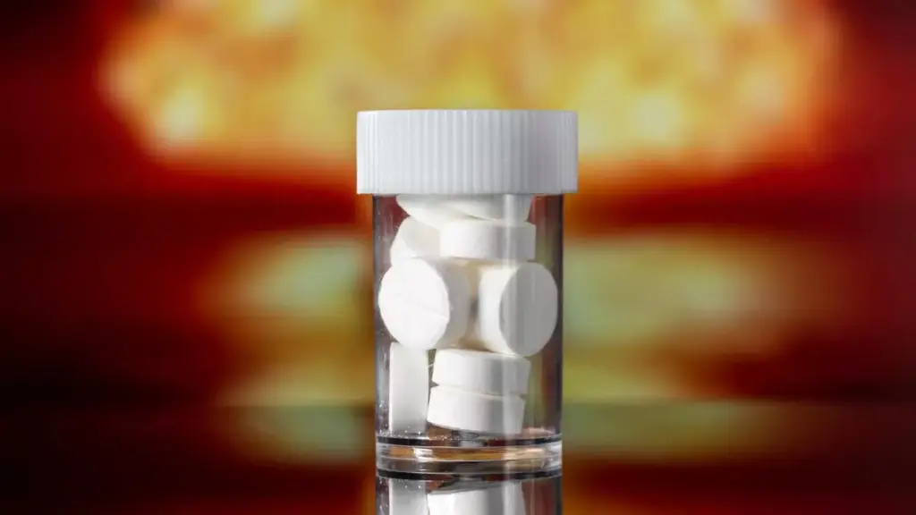 A detailed close-up view of the "Tylenol Arthritis Extended Release" product, showcasing its bottle and the distinctive red and white packaging design. The product is illuminated by warm, directional lighting, casting subtle shadows that accentuate its three-dimensional form. The focus is crisp and the depth of field is shallow, drawing the viewer's attention to the intricate label details. The overall mood is one of clarity and professionalism, reflecting the product's medical nature and positioning as a trusted arthritis relief solution.