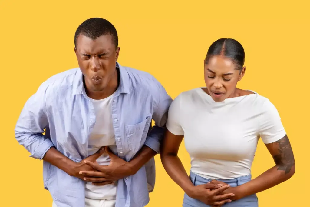 African american couple with stomach pain