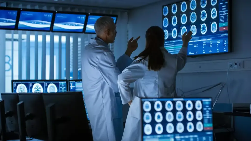 medical doctors discussing mri brain scans medical doctors discussing mri brain scans