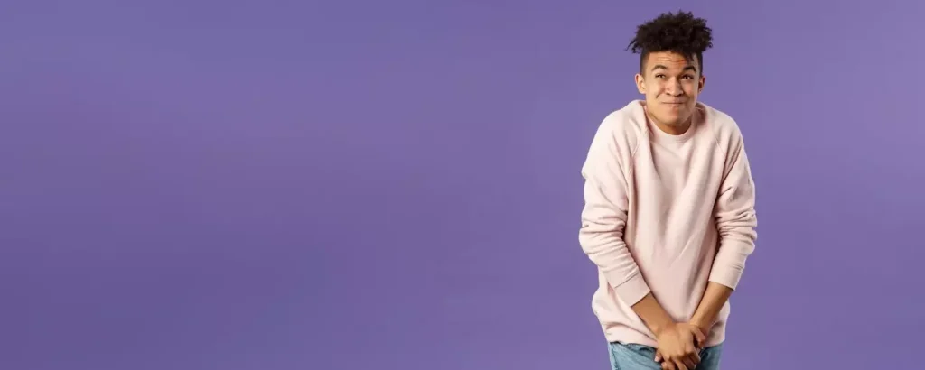 Portrait of young man need to pee cant hold it in