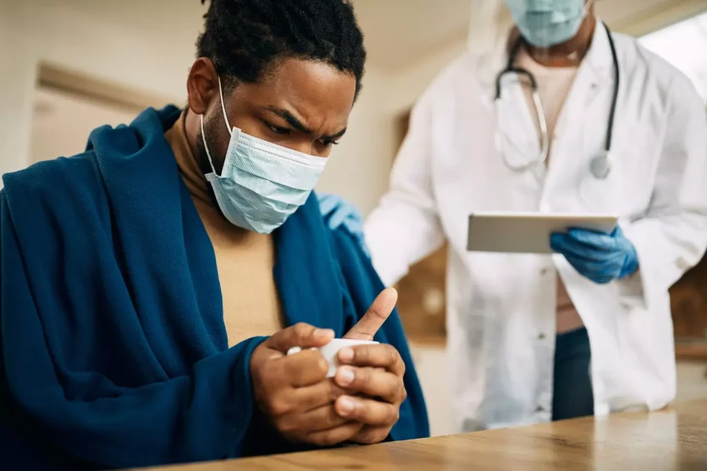 A doctor talking to a patient A doctor talking to a patient