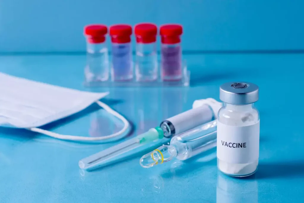 A close-up view of a syringe filled with a  the BCG (Bacillus Calmette-Guérin) immunotherapy solution. The syringe is set against a blurred background of medical equipment, suggesting a clinical setting. The lighting is soft and diffused, creating a sense of professionalism and care. The composition emphasizes the syringe as the central focus, conveying the importance of BCG as a leading immunotherapy option for bladder cancer treatment.