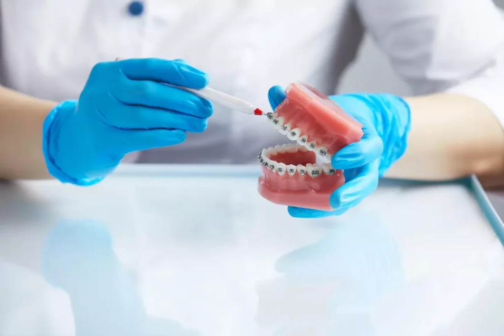 A detailed cross-sectional view of the dental bone implant process. In the foreground, a lifelike dental implant is precisely inserted into the jawbone, revealing the intricate internal structure. The middle ground showcases the bone graft material being carefully packed around the implant, stimulating natural bone growth. In the background, the surrounding healthy teeth and gums are visible, captured with a shallow depth of field for focus on the implant procedure. Warm, natural lighting illuminates the scene, creating a sense of clinical precision and medical expertise. The overall composition conveys the technical complexity and careful steps involved in this specialized dental treatment. A detailed cross-sectional view of the dental bone implant process. In the foreground, a lifelike dental implant is precisely inserted into the jawbone, revealing the intricate internal structure. The middle ground showcases the bone graft material being carefully packed around the implant, stimulating natural bone growth. In the background, the surrounding healthy teeth and gums are visible, captured with a shallow depth of field for focus on the implant procedure. Warm, natural lighting illuminates the scene, creating a sense of clinical precision and medical expertise. The overall composition conveys the technical complexity and careful steps involved in this specialized dental treatment.
