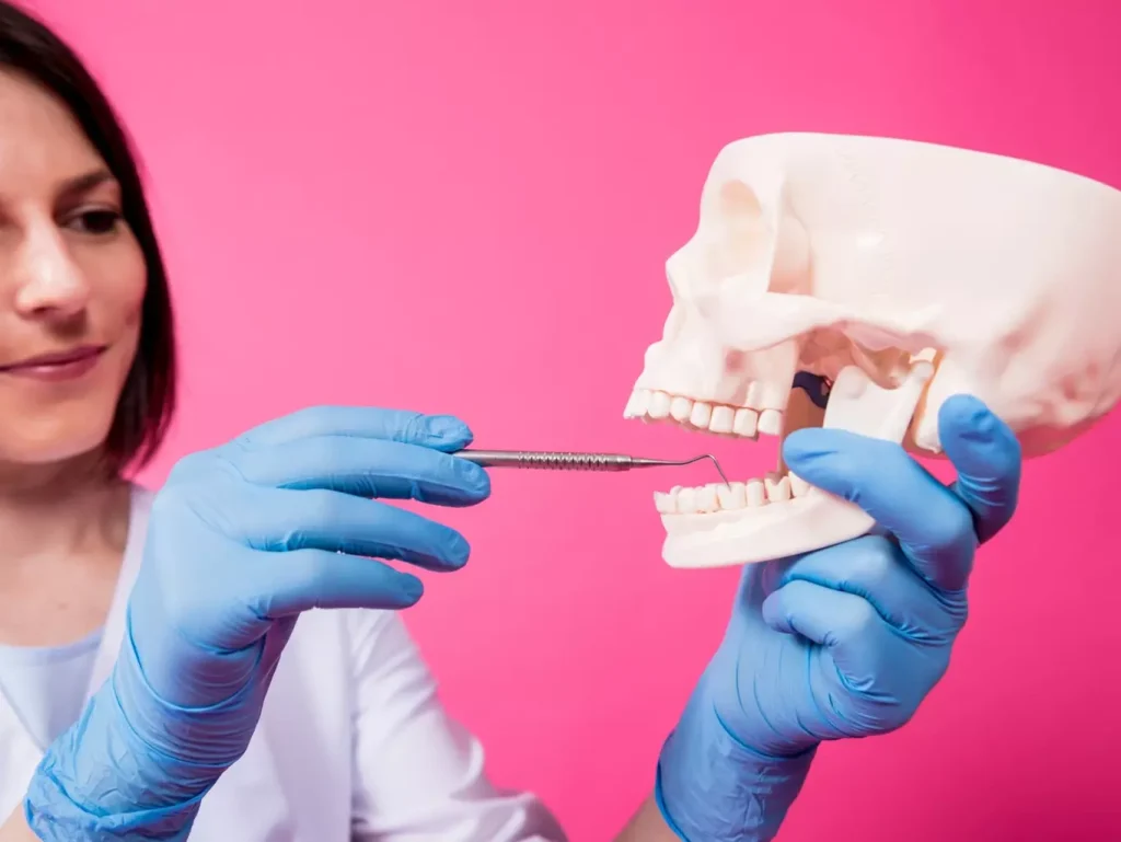 A detailed close-up view of a human jawbone with a missing tooth, showcasing the need for a bone graft procedure. The jawbone appears slightly worn and discolored, indicating a lack of adequate bone density. The scene is illuminated by soft, warm lighting from the side, casting subtle shadows that accentuate the bone's structure and texture. The camera angle is slightly angled, providing a perspective that draws the viewer's attention to the specific area of concern. The background is blurred, keeping the focus on the jawbone and the surgical necessity. A detailed close-up view of a human jawbone with a missing tooth, showcasing the need for a bone graft procedure. The jawbone appears slightly worn and discolored, indicating a lack of adequate bone density. The scene is illuminated by soft, warm lighting from the side, casting subtle shadows that accentuate the bone's structure and texture. The camera angle is slightly angled, providing a perspective that draws the viewer's attention to the specific area of concern. The background is blurred, keeping the focus on the jawbone and the surgical necessity.