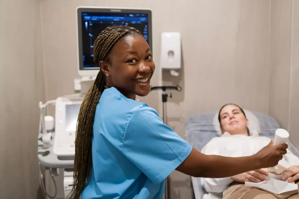 A clinical examination room with a bright, sterile lighting. On the examination table, a patient's arm is exposed, revealing the skin and underlying musculature. A healthcare professional, wearing scrubs and gloves, is carefully inserting a long, thin needle into the patient's arm, extracting a sample of bone marrow. The procedure is being performed with precision and care, capturing the technical nature of a bone marrow biopsy. The atmosphere is one of medical professionalism, with a focus on the delicate and necessary task at hand.