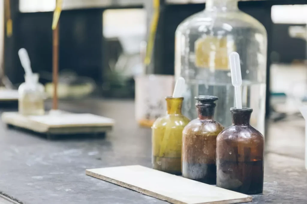 A dimly lit laboratory setting, with a central table showcasing various alternative medicine bottles, vials, and herbal remedies. In the foreground, a detailed illustration of the female reproductive system, focusing on the ovaries. The background features scientific diagrams, charts, and medical imagery, conveying a sense of research and exploration. Soft, warm lighting casts a contemplative atmosphere, suggesting the pursuit of natural, holistic approaches to addressing ovarian cancer. The composition is balanced, drawing the viewer's attention to the core elements of alternative therapies for this condition.