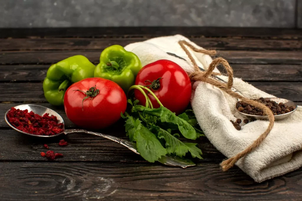 A delicate still life capturing the essence of an anti-inflammatory diet for ovarian cancer. In the foreground, an array of vibrant vegetables, including leafy greens, colorful peppers, and fresh herbs, arranged in a rustic wooden bowl. In the middle ground, a glass jar filled with a soothing herbal tea, its steam gently rising. The background features an open book showcasing research on the benefits of anti-inflammatory nutrition, illuminated by soft, natural lighting. The overall composition conveys a sense of tranquility, nourishment, and a holistic approach to wellness.