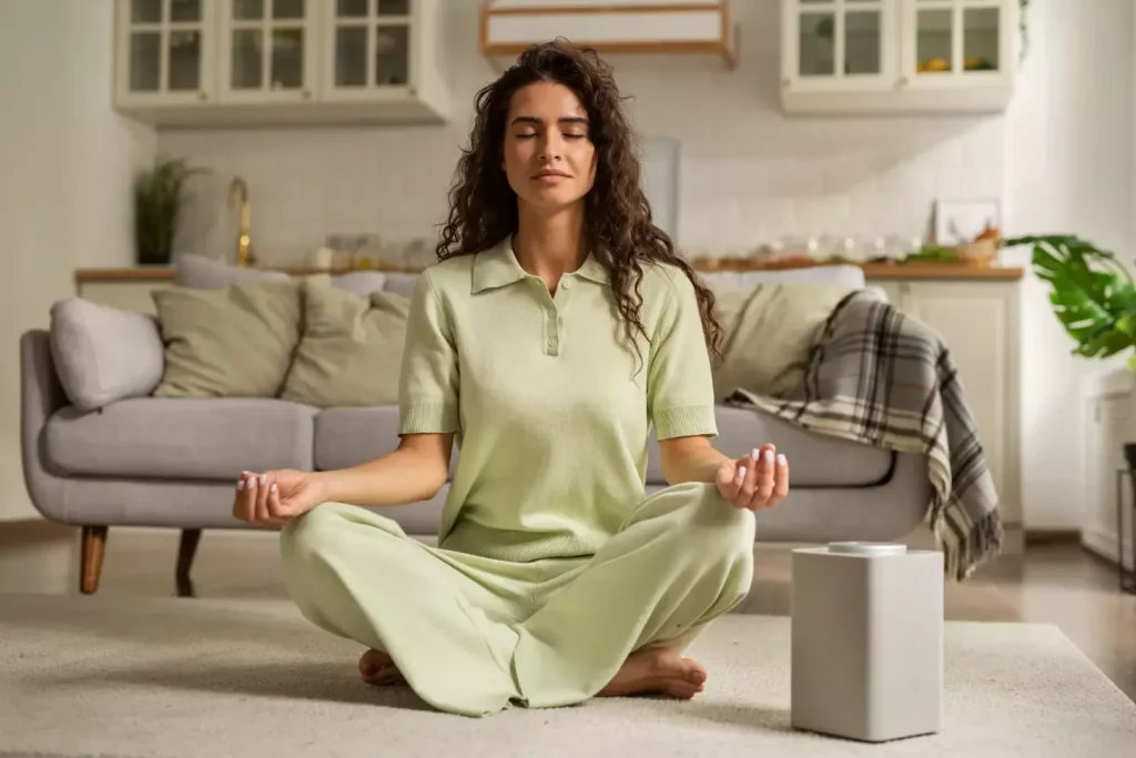 A peaceful, serene scene depicting the holistic treatment for cervical cancer. In the foreground, a woman sits in a lotus position, eyes closed, deep in meditation. Her expression is one of calm tranquility. In the middle ground, an array of natural remedies - herbal tinctures, essential oils, and acupuncture needles - are neatly arranged on a wooden table. The background features a lush, verdant garden with soothing water features and a gentle breeze rustling the leaves. Soft, diffused lighting casts a warm, healing glow over the entire scene. The overall atmosphere conveys a sense of balance, harmony, and wholeness in the holistic approach to treating cervical cancer.
