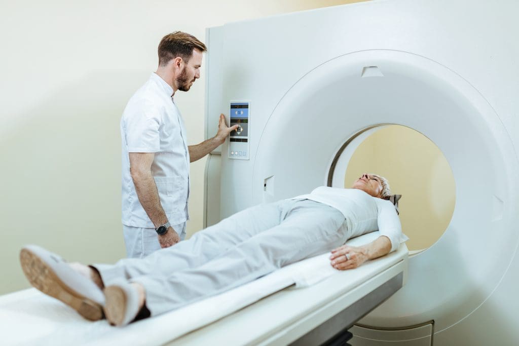 medical technician mature patient mri scanning procedure clinic LIV Hospital
