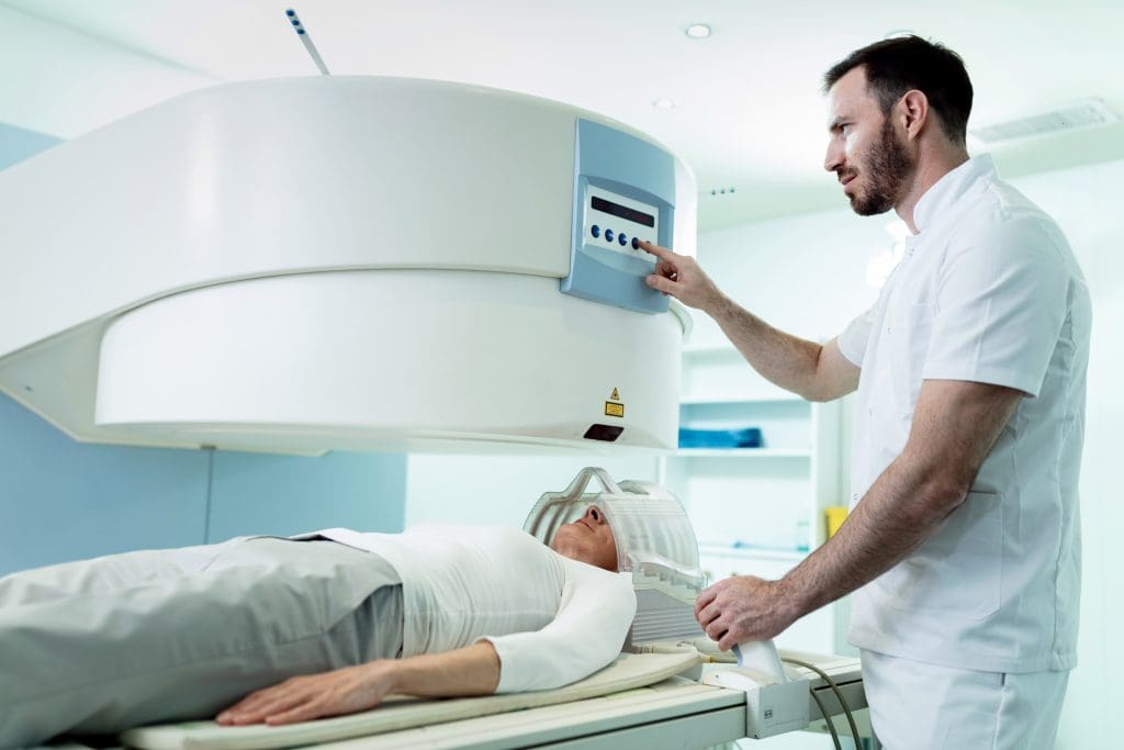 medical technician starting head mri scan procedure female patient hospital 1 1 LIV Hospital