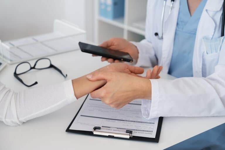 high angle doctor holding patient s hand LIV Hospital