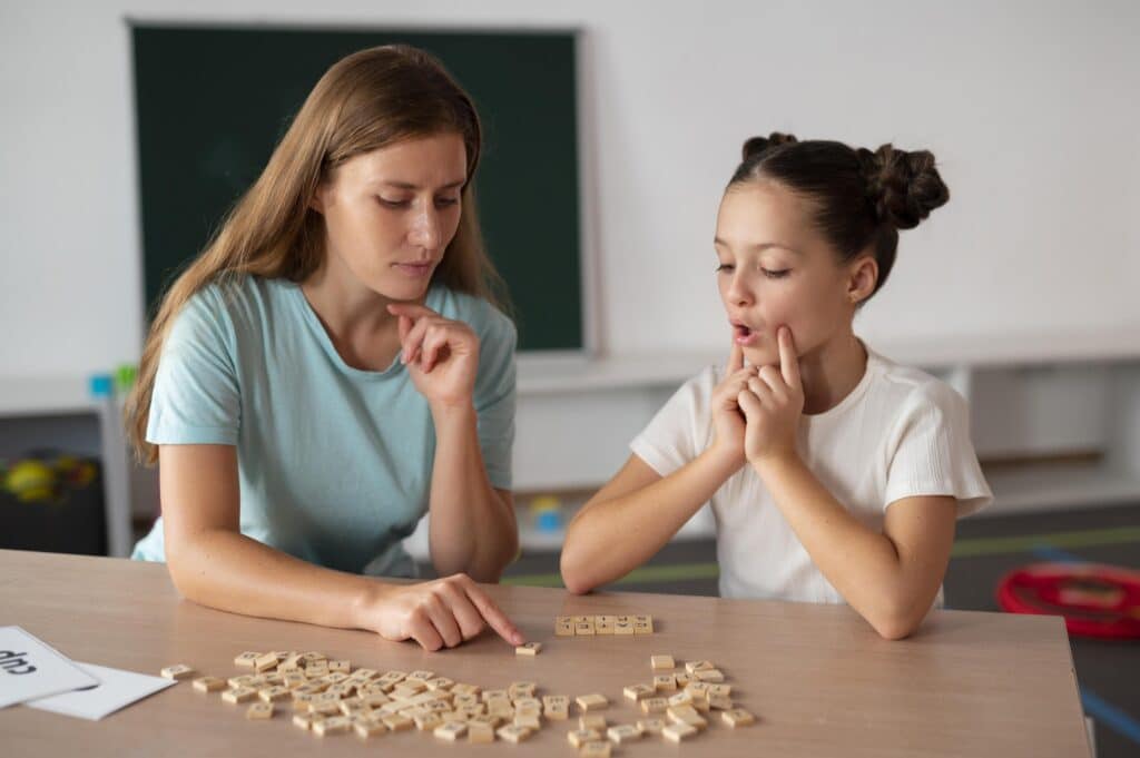 psychologist helping little girl speech therapy indoors 1 2 LIV Hospital