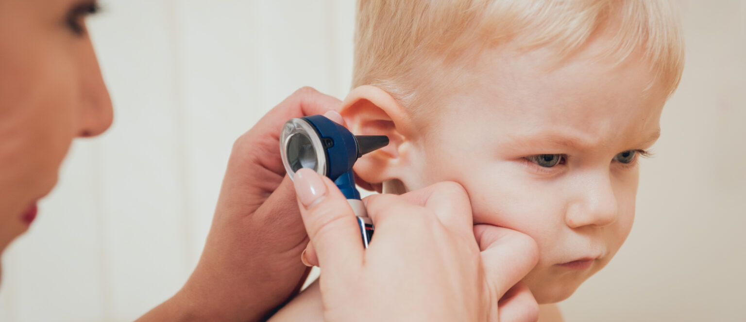 doctor examines ear with otoscope pediatrician room 1 LIV Hospital