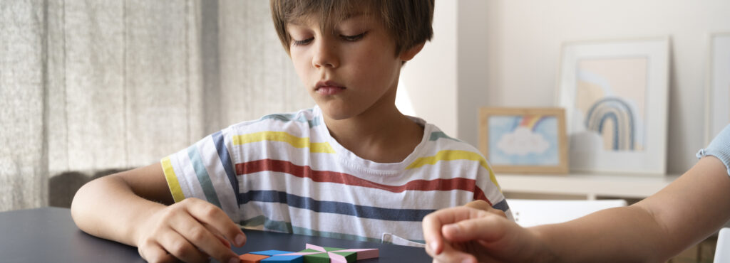 front view kid making puzzle table 1 LIV Hospital