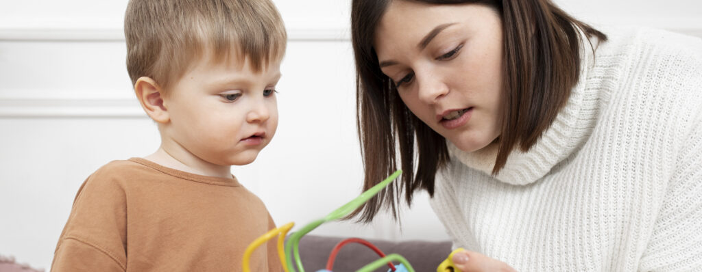 medium shot mother child with game 1 LIV Hospital