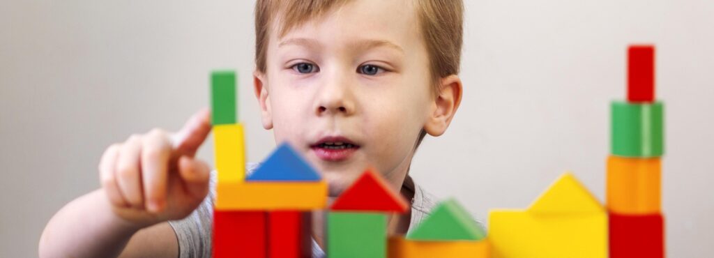 kid playing with different colorful shapes 1 1 LIV Hospital