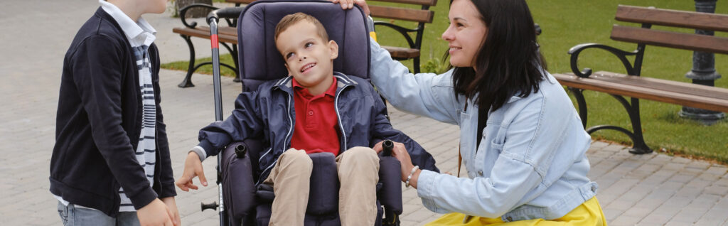 family with child that has cerebral palsy wheelchair with mother brother 1 LIV Hospital