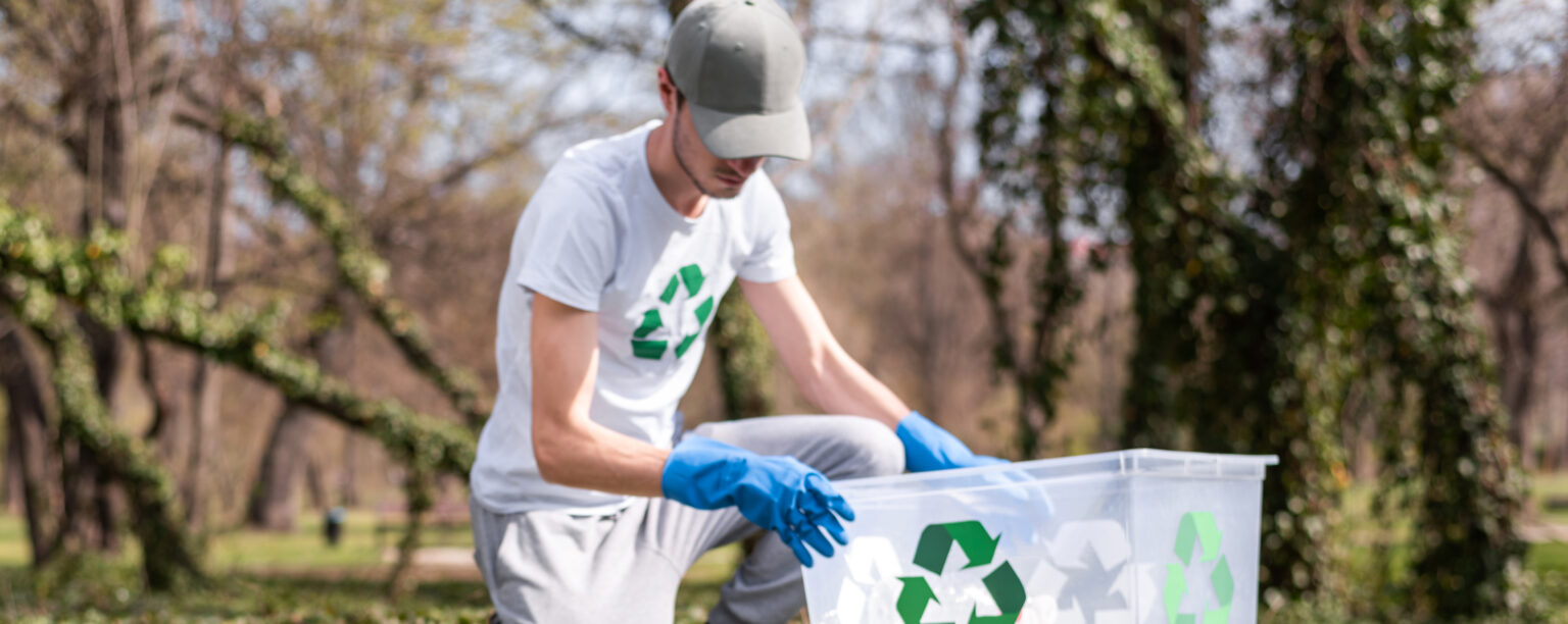 man collecting plastic garbage polluted park 2 LIV Hospital