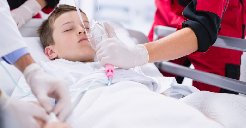 doctors adjusting oxygen mask while rushing patient emergency room 2 1 LIV Hospital