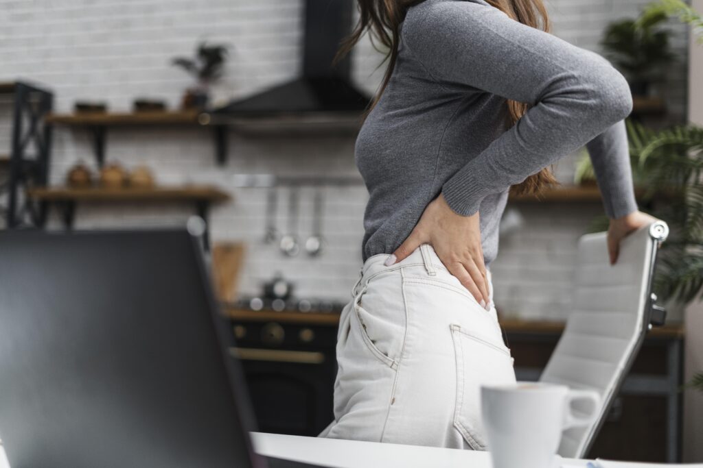 Current image: side-view-woman-having-backache-while-working-from-home (1)