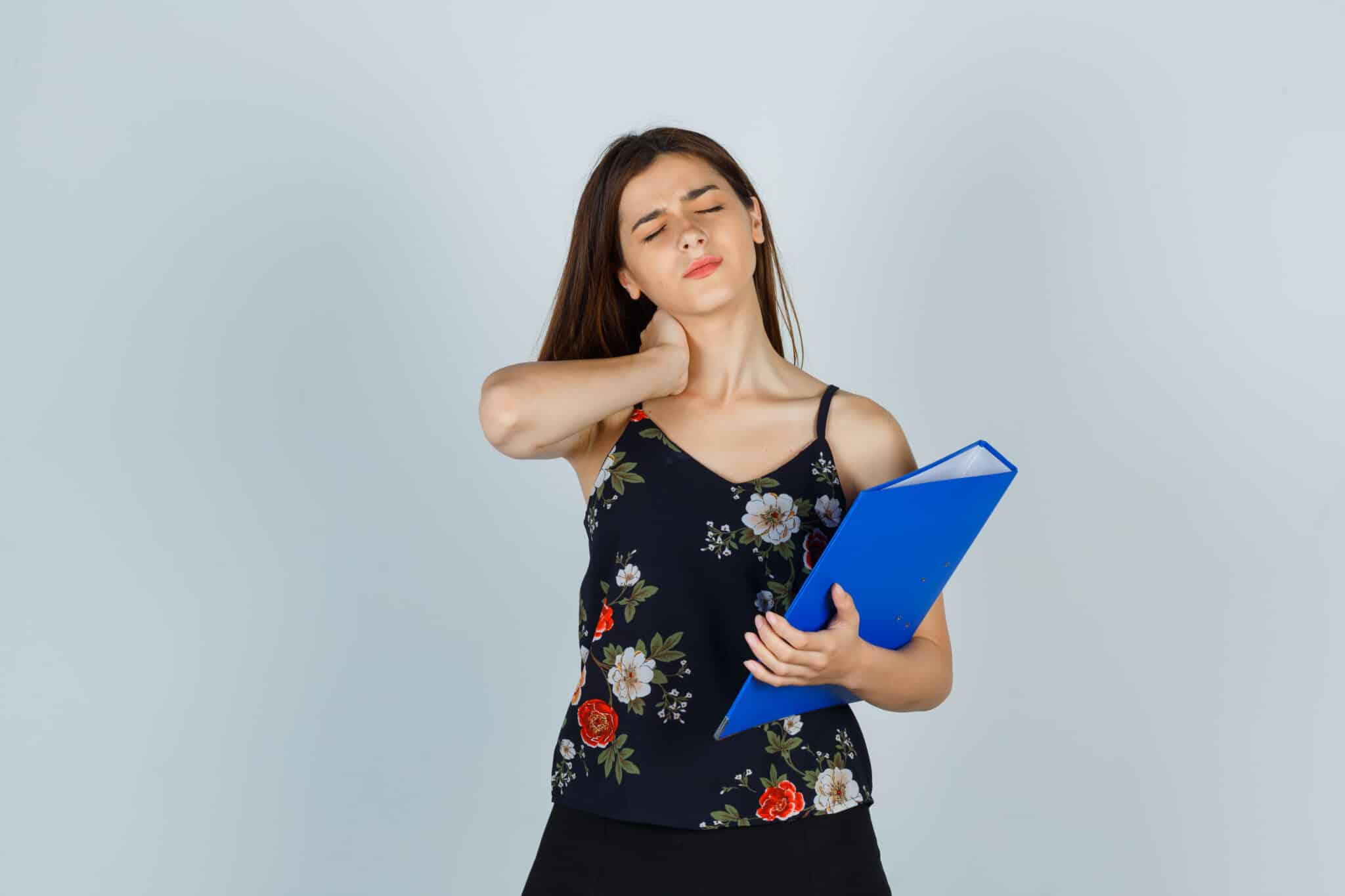 portrait-young-lady-holding-folder-having-neck-pain-blouse-skirt-looking-fatigued-front-view