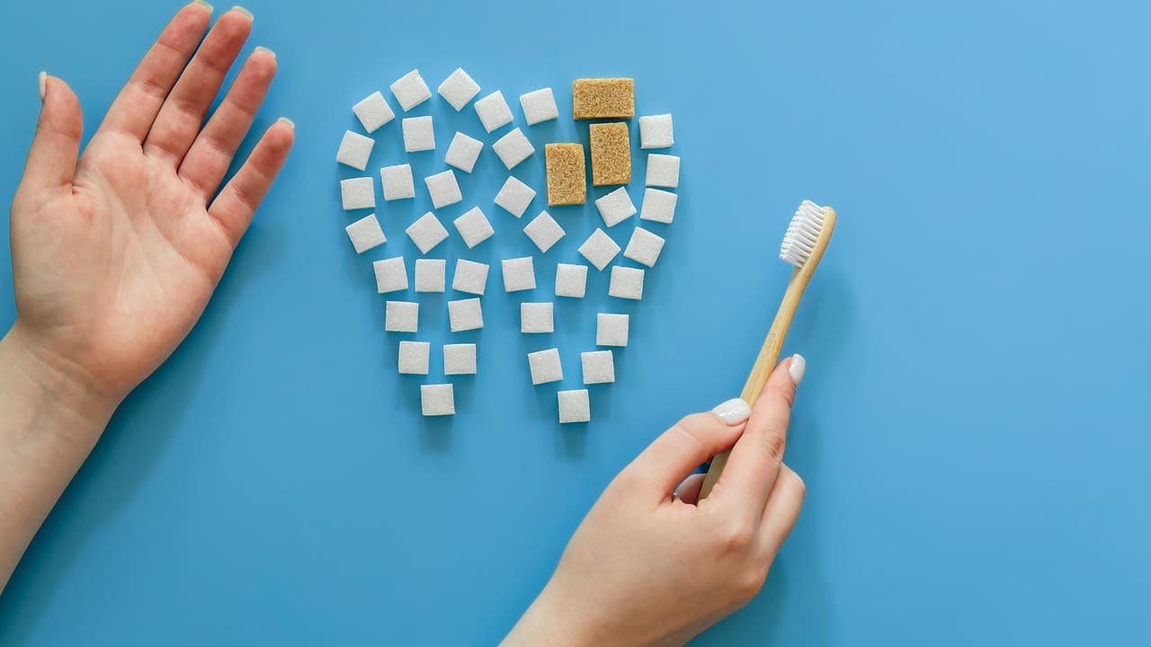 flat lay tooth made sugar blue background yt thumbnail 1280 720 LIV Hospital
