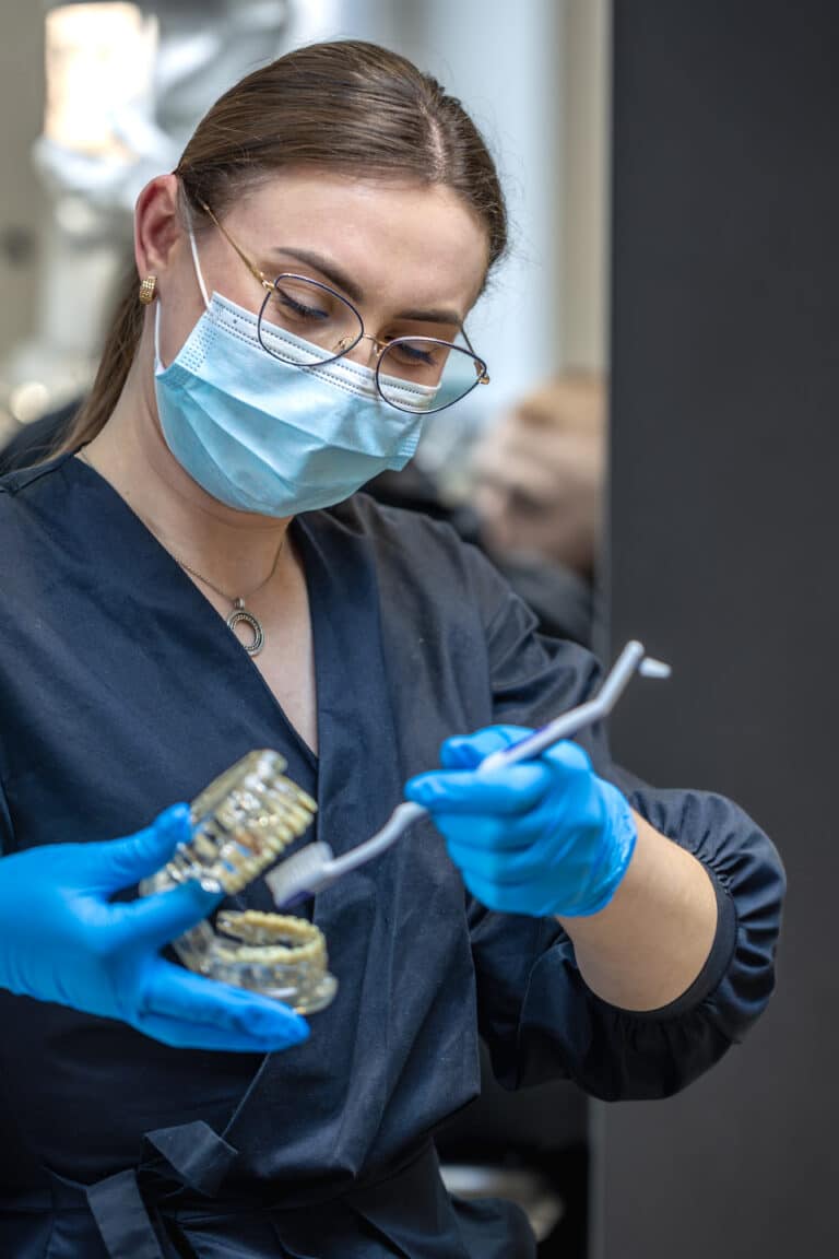 female dentist holding dental model hands concept dentistry dental treatment LIV Hospital