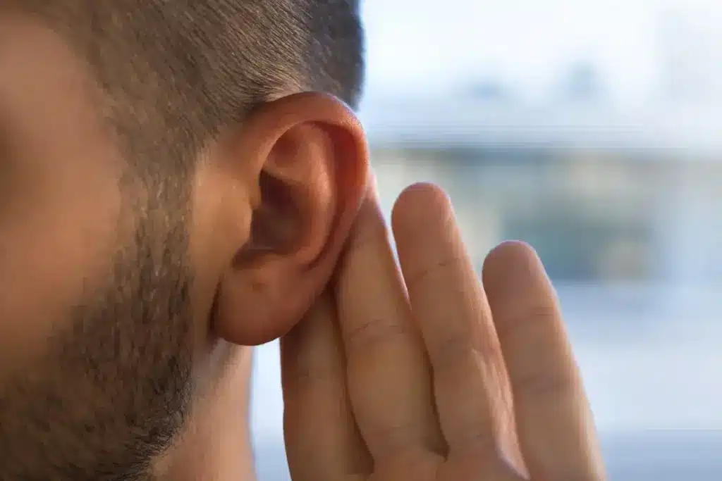 diagram of human head with sound waves passing through